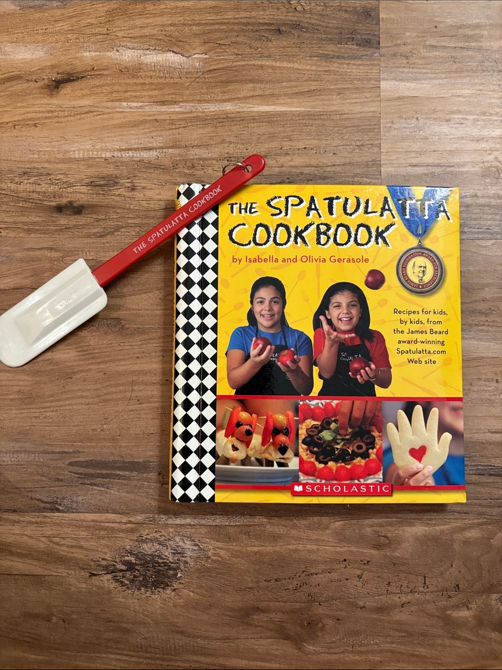 The Spatulatta Cookbook with Red Spatula by Scholastic.